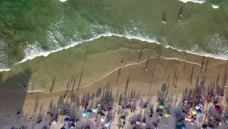 Aerial-static-shot-of-Bombas-beach-and-its-transparent-waters-at-golden-hour