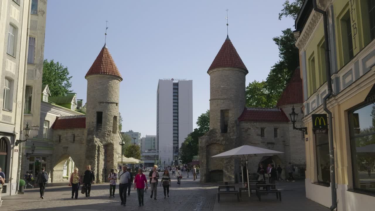 Old city Gate of Tallinn, Estonia with crowd of people walking