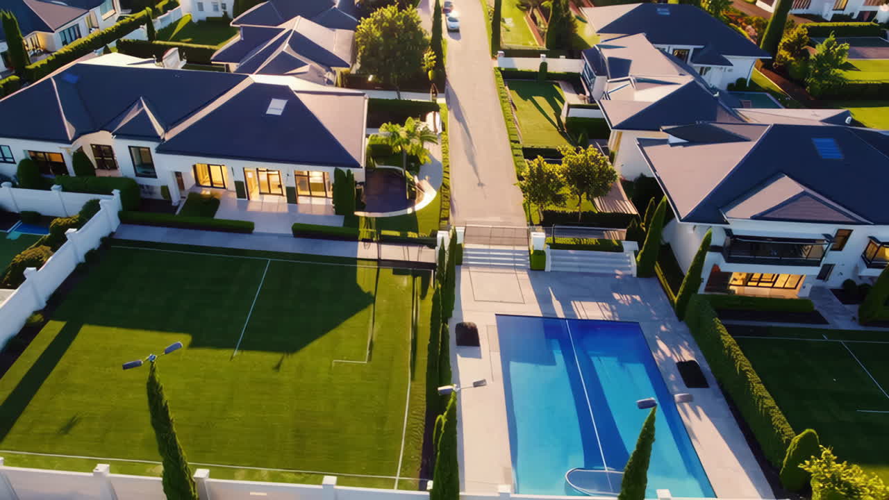 Aerial View of Luxurious Residential Neighborhood with Mansions and Pools