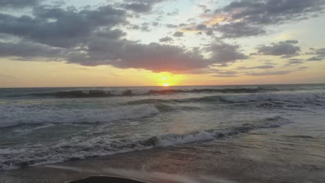 Waves-crashing-on-beach-at-sunset-in-Latin-America