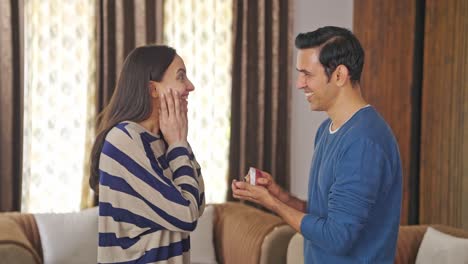 Happy-Indian-man-proposes-to-his-excited-girlfriend