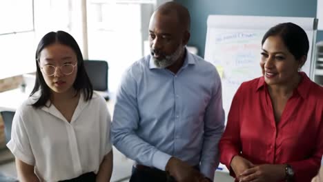 engaging business discussion among diverse colleagues in a modern office setting: focus on collaboration, ideas, and team dynamics