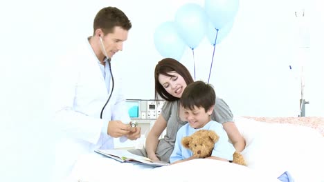 doctor listening with a stethoscope to a teddy bear