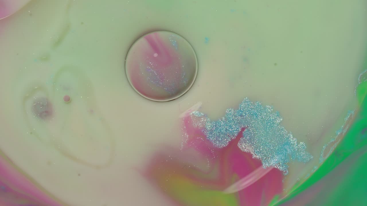 Macro structure of multicolored water paint oil bubbles movement, bright colorful acrylic painting