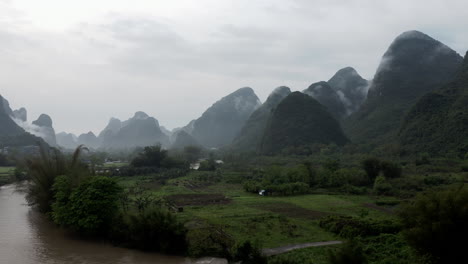 misty karst mountains and river valley in china