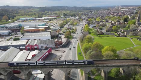 drone shot over leeds, uk, busy main road in the summertime