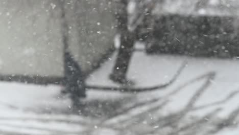 Slow-motion-of-falling-snow-and-walking-people