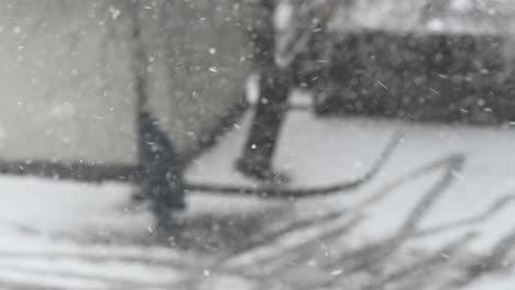 slow motion of falling snow and walking people