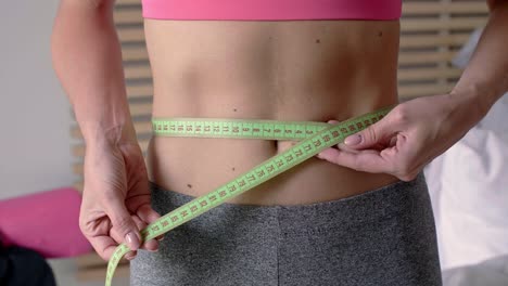 Slim-woman-with-measuring-tape