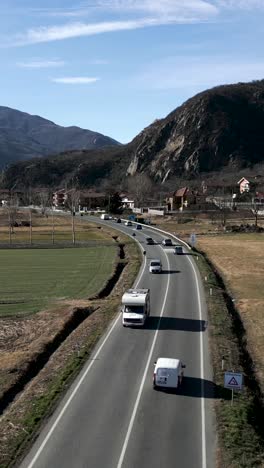 Road with Vehicles in a Mountainous Countryside