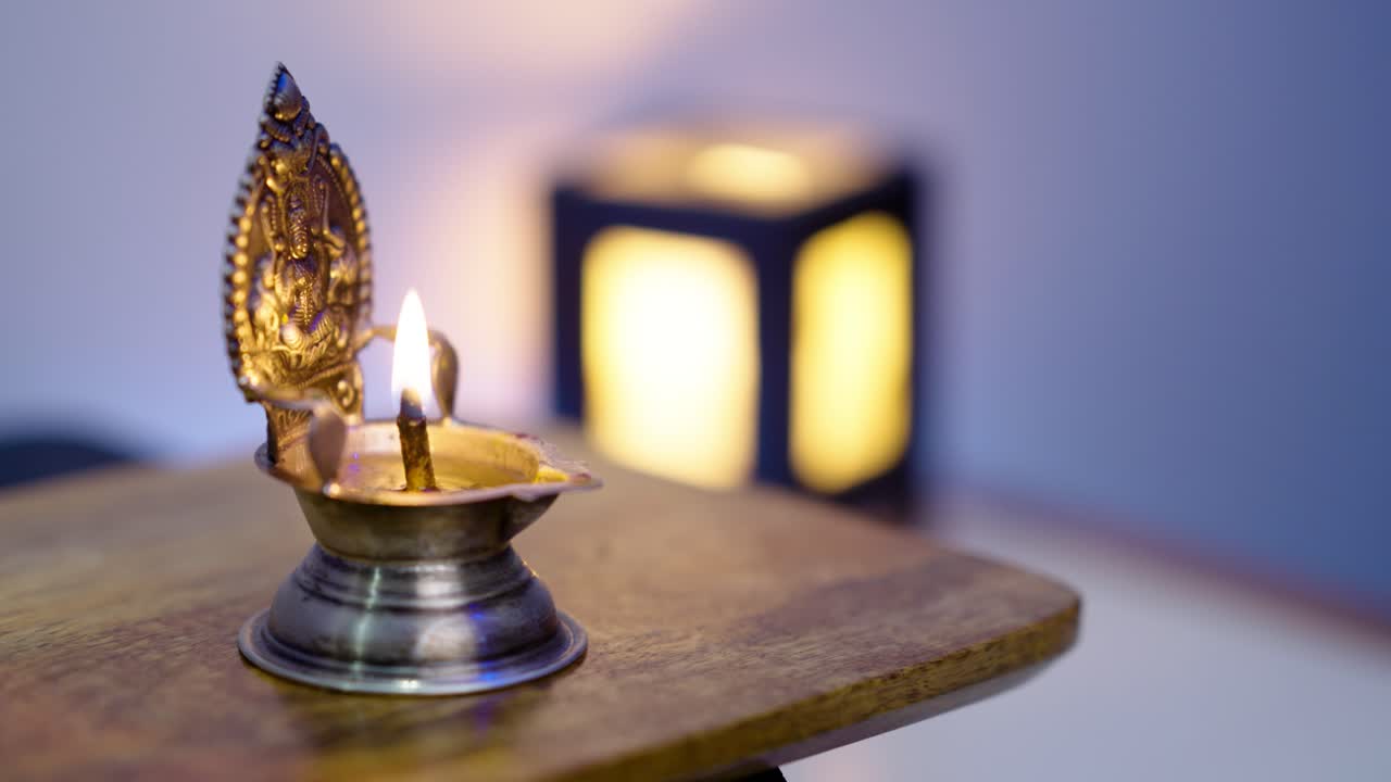 Lighting Silver Pooja Diya with Matchstick – Traditional Hindu Ritual, Spiritual Worship, and Religious Ceremony Concept