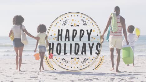 Animation-of-christmas-greetings-text-over-biracial-couple-with-son-and-daughter-on-beach