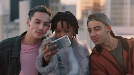 happy group of friends posing for selfie photo enjoying rooftop party celebration having fun making faces sharing weekend in city on social media