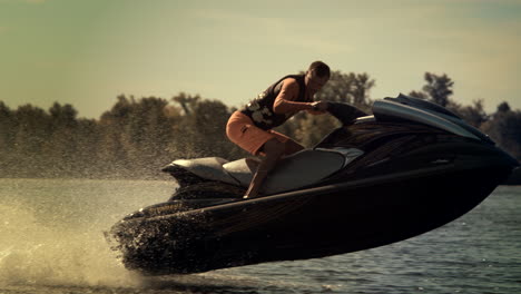 rider jumping on jet ski on waves