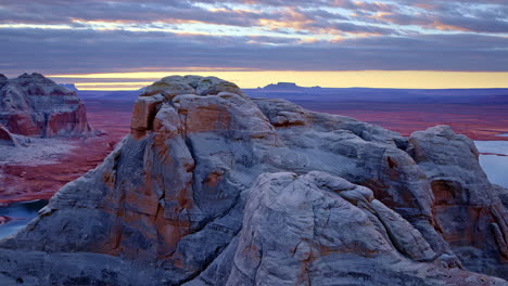 a majestic aerial shot circles the eroded cliffs of glen canyon, offering stunning views of lake powell.