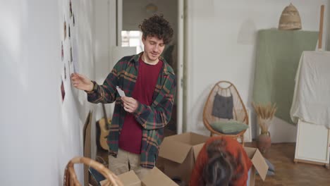 couple looking at a photo while moving into a new home