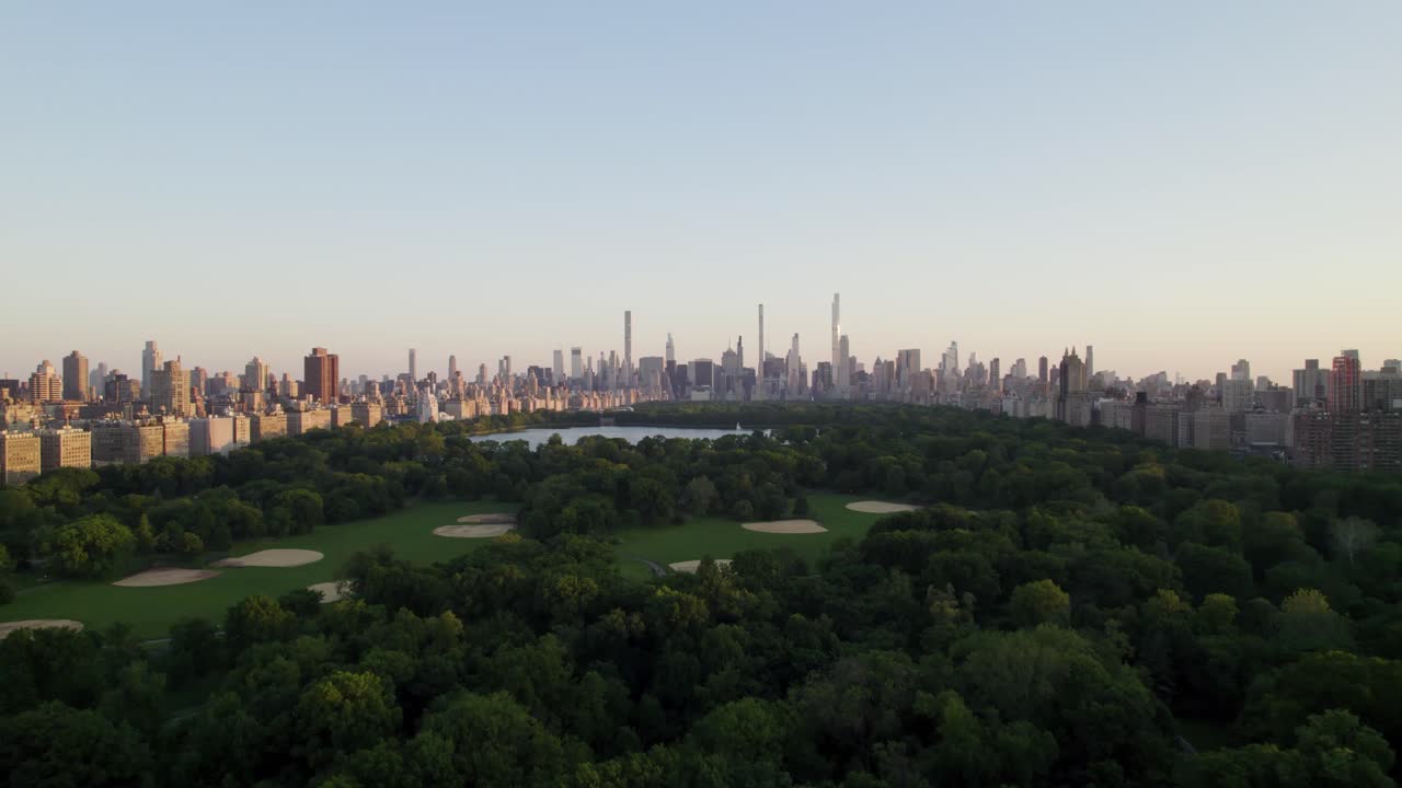 Serene drone shot of New York City and Central Park in summer