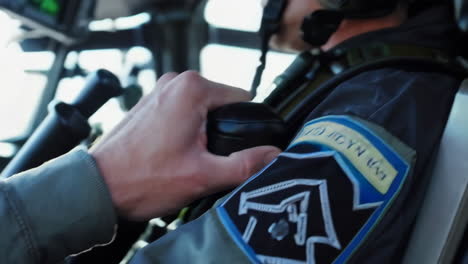 military helicopter pilot in cockpit