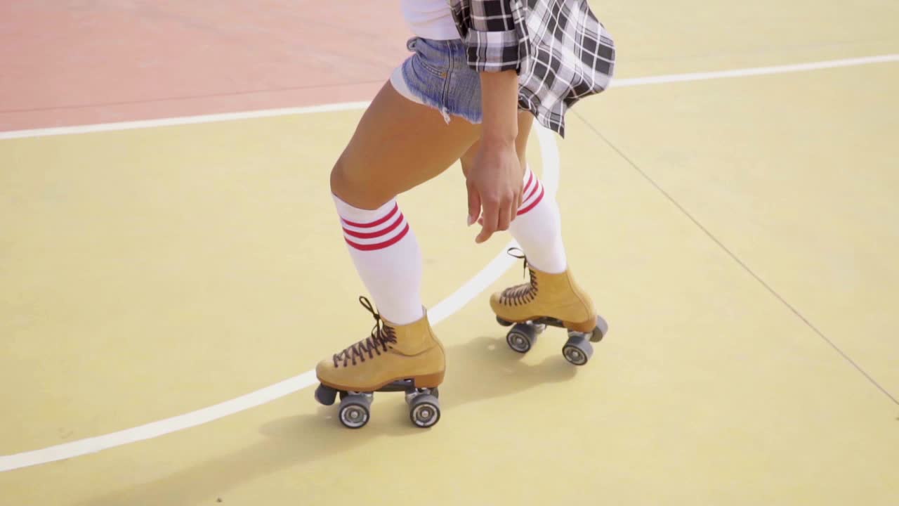 Young woman roller skating outdoors