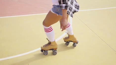 Young-woman-roller-skating-outdoors