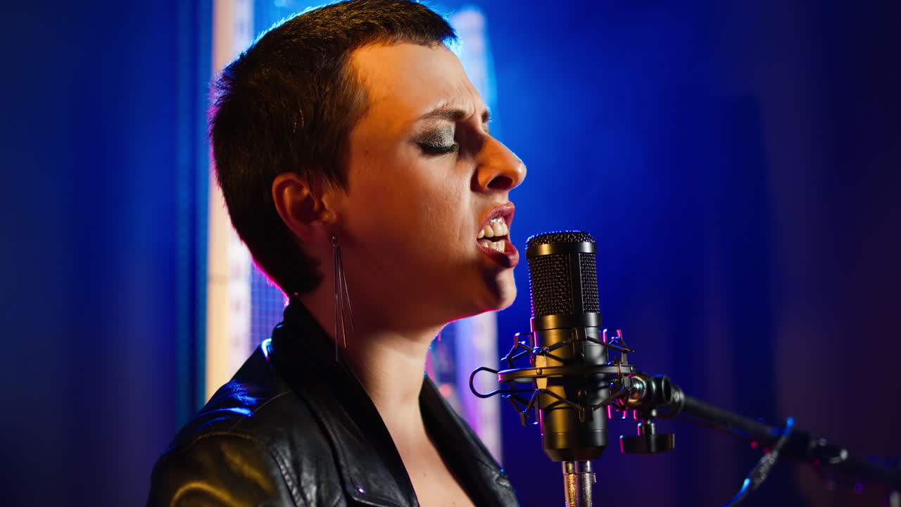 Singer Performing on Stage with Microphone