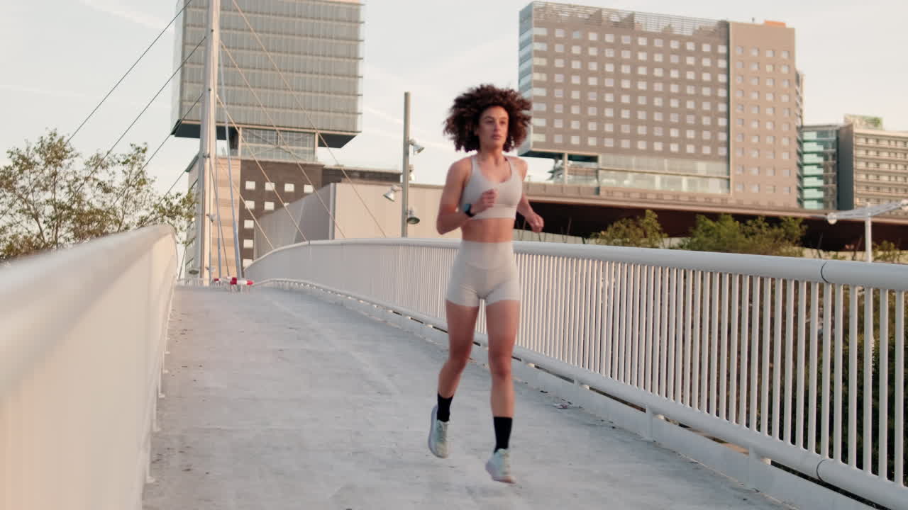 Woman Runs Across City Bridge
