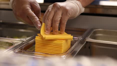 sliced cheddar cheese used to make cheeseburgers