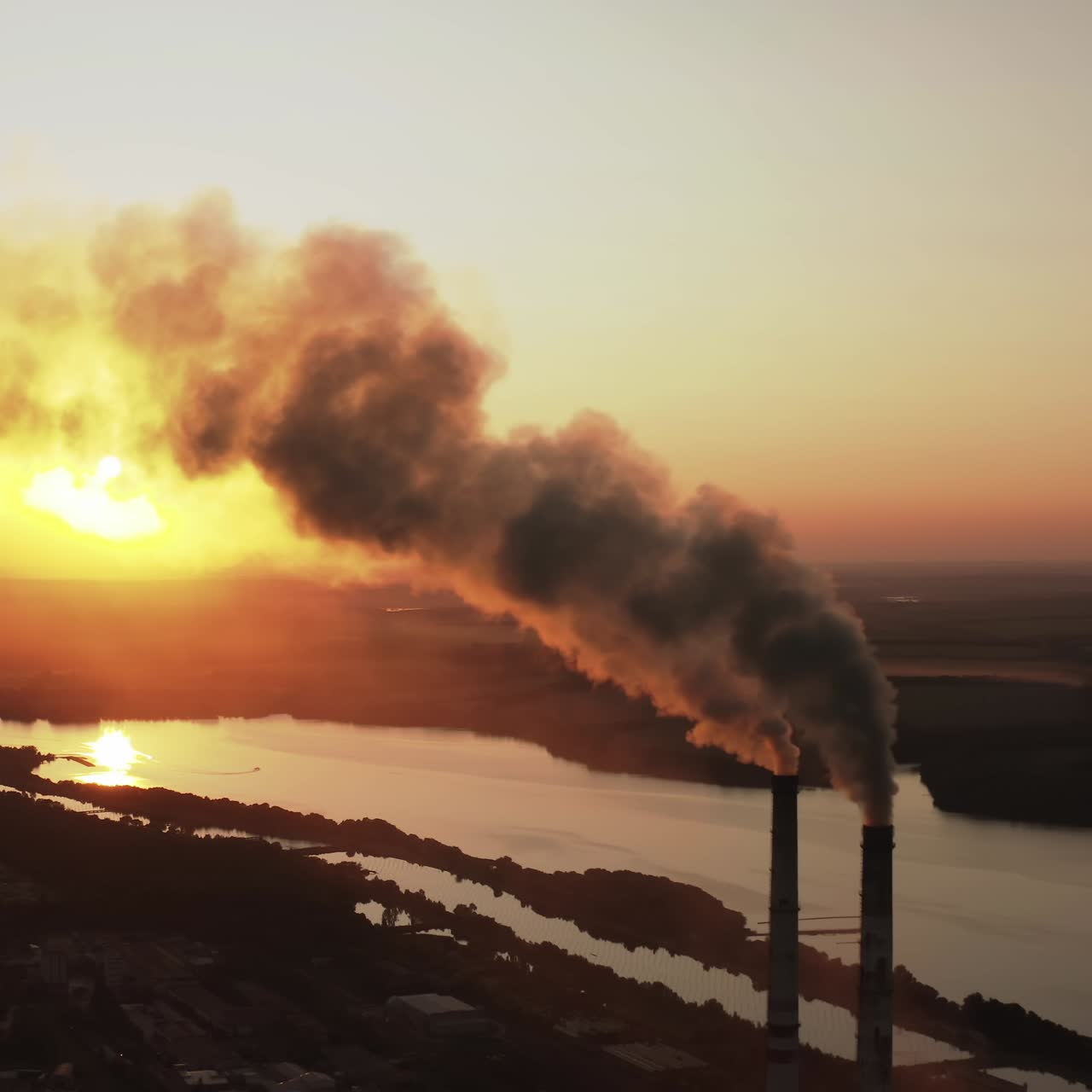 Plant with smoking smokestack. Problem of environmental pollution by factories