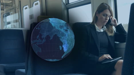 animation of blue globe over businesswoman on train using smartphone and tablet