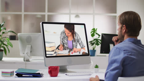 Caucasian-male-teacher-using-computer-on-video-call-with-female-student