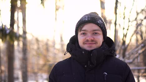 man in a winter forest