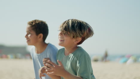 Close-up-shot-of-happy-friends-kicking-soccer-ball-with-head