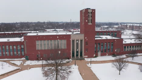 front entrance, large american school, college building during winter