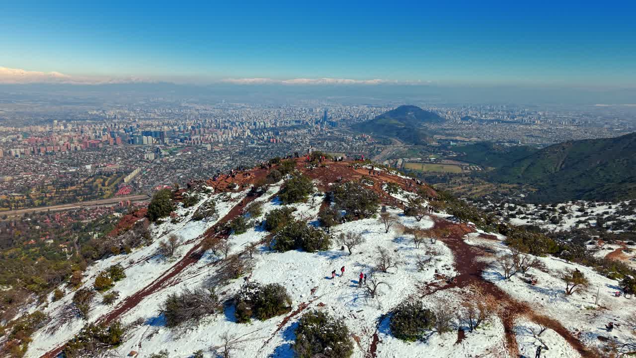 Aerial fly Manquehuito Hill, Santiago de Chile Skyline, Andes Mountains Background, Drone Panoramic View