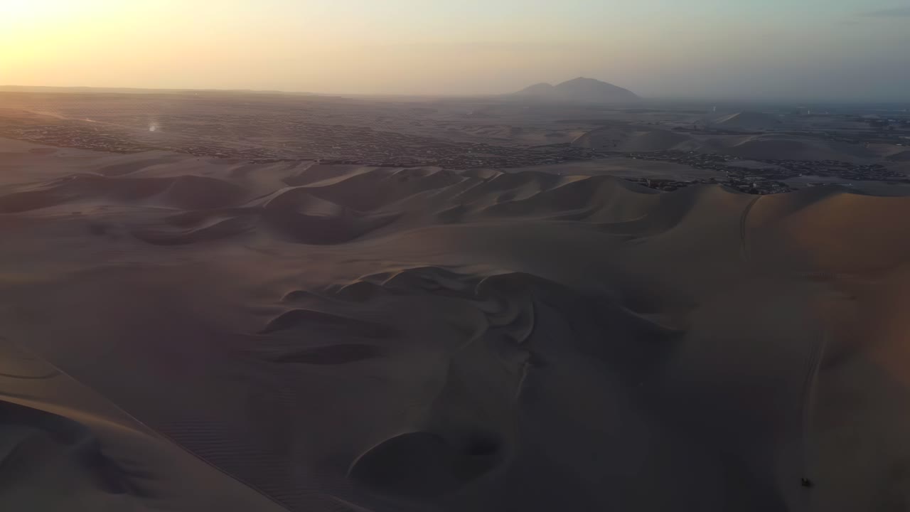 Sunset in the desert of Peru, aerial drone sand dunes empty land landscape