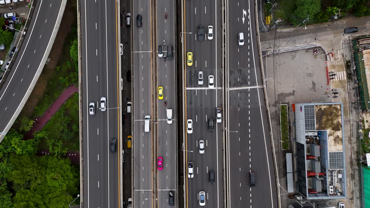 Birds Eye Drone Shot Cars Driving on Large Multi Lane Highway in Busy Urban City