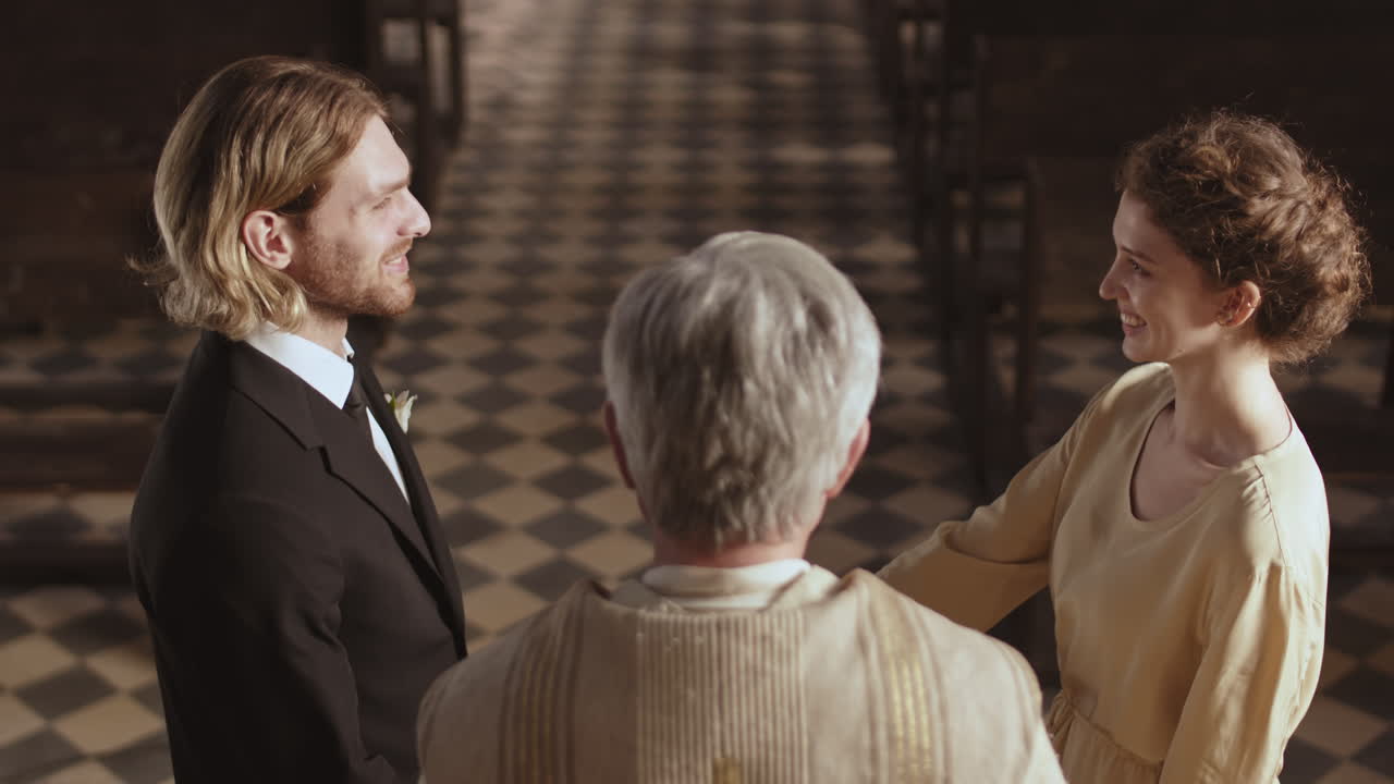 Senior Priest Solemnizing Marriage in Christian Church