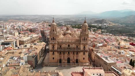 Spain-Jaen-Cathedral,-Catedral-de-Jaen,-flying-shoots-of-this-old-church-with-a-drone-at-4k-24fps-using-a-ND-filter-also-it-can-be-seen-the-old-town-of-Jaen