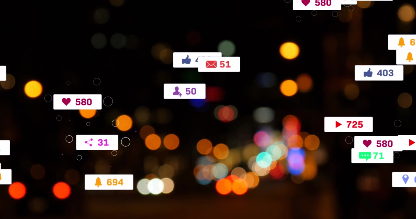 Animation of social media icons and numbers over out of focus city lights
