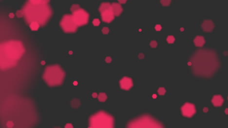 brillos rojos y partículas sobre fondo negro