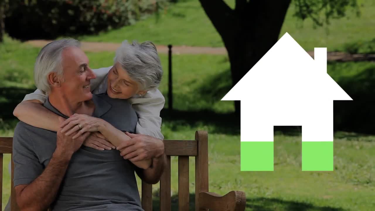 Senior couple outdoors and house iocn filling green