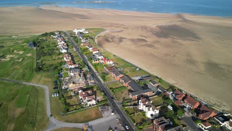 Fly-over-houses-near-Royal-Liverpool-Golf-Club,-Hoylake,-Wirral,-UK---Aerial-drone