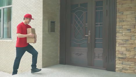 delivery man uniform smiles during express, courier holding a small package parcel delivering goods to customer's home with van truck, door-to-door services