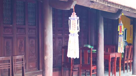 lanterns hanging outside tran quoc temple, hanoi