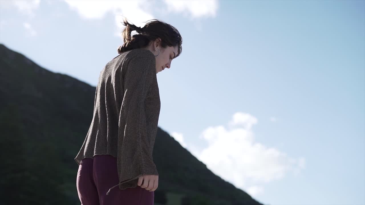 A woman in a natural landscape