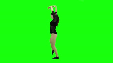 side view of a beautiful model dancing in front of a green screen