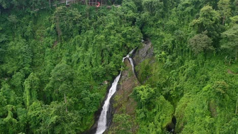 kerta gangga waterfall surrounded by a dense forest in lombok indonesia