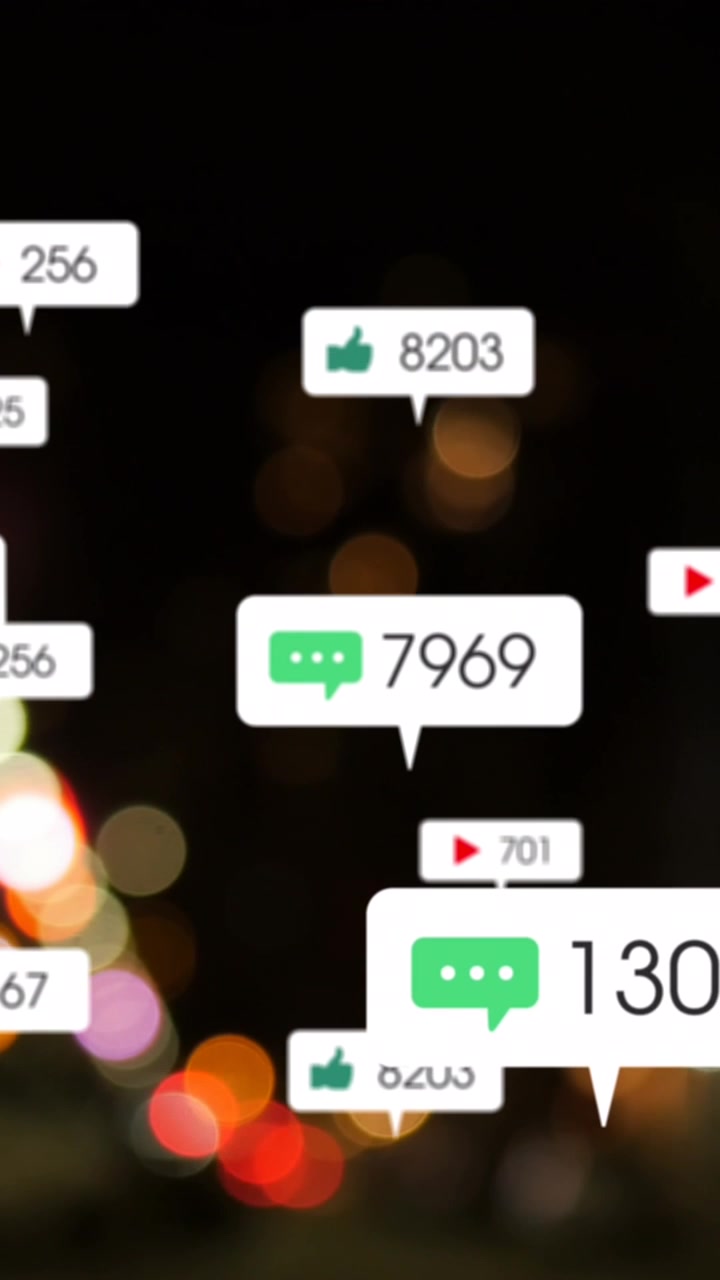 Animation of social media icons and numbers over out of focus city lights