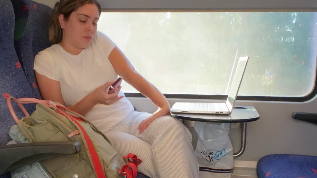 A Quiet Moment of Digital Connection During a Train Trip