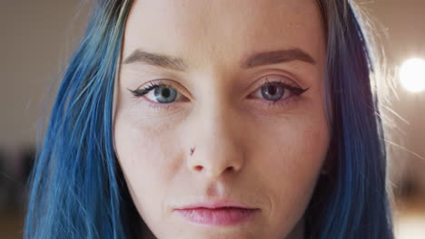 portrait of happy caucasian woman looking at camera in dance studio, slow motion